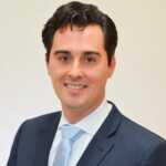 Chris Glass Attorney RGLZ Law Man in blue suit blue tie